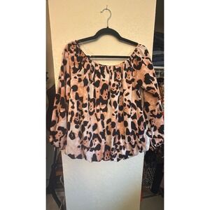 Pink and black off shoulder or on long sleeve blouse